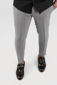 Black and white plaid patterned trousers/pants
