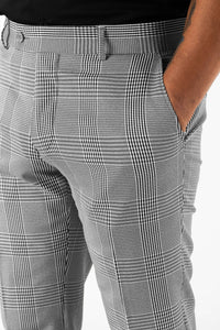 Black and white plaid patterned trousers/pants