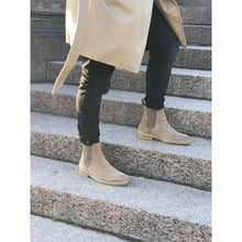 tan chelsea style boot with black pants 