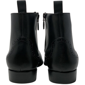 Double back side view; black chelsea leather boot