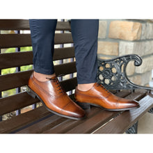 Mens brown leather shoes, brogue design, no medallion with navy pants